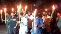 হামলার প্রতিবাদে নগরে মশাল মিছিল